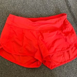 Orange Lululemon shorts